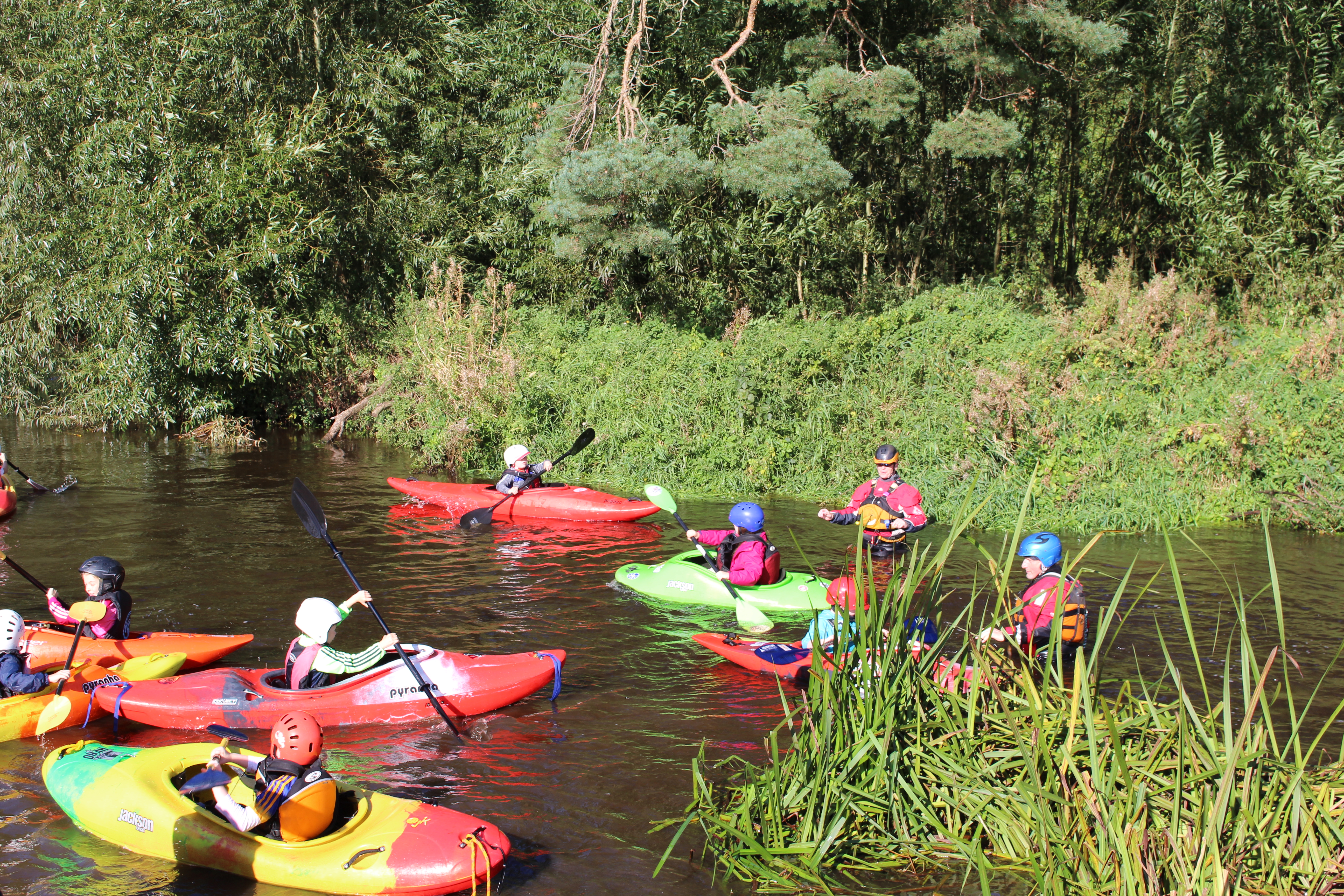 Local kids get to try out a kayak under expert supervision