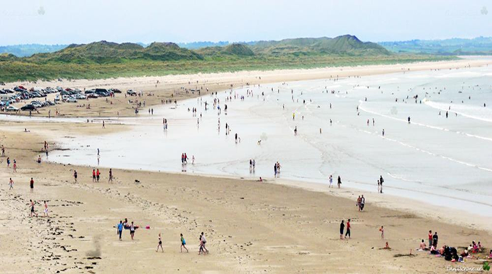 FIGURE 1: BATHERS ON ENNISCRONE BEACH