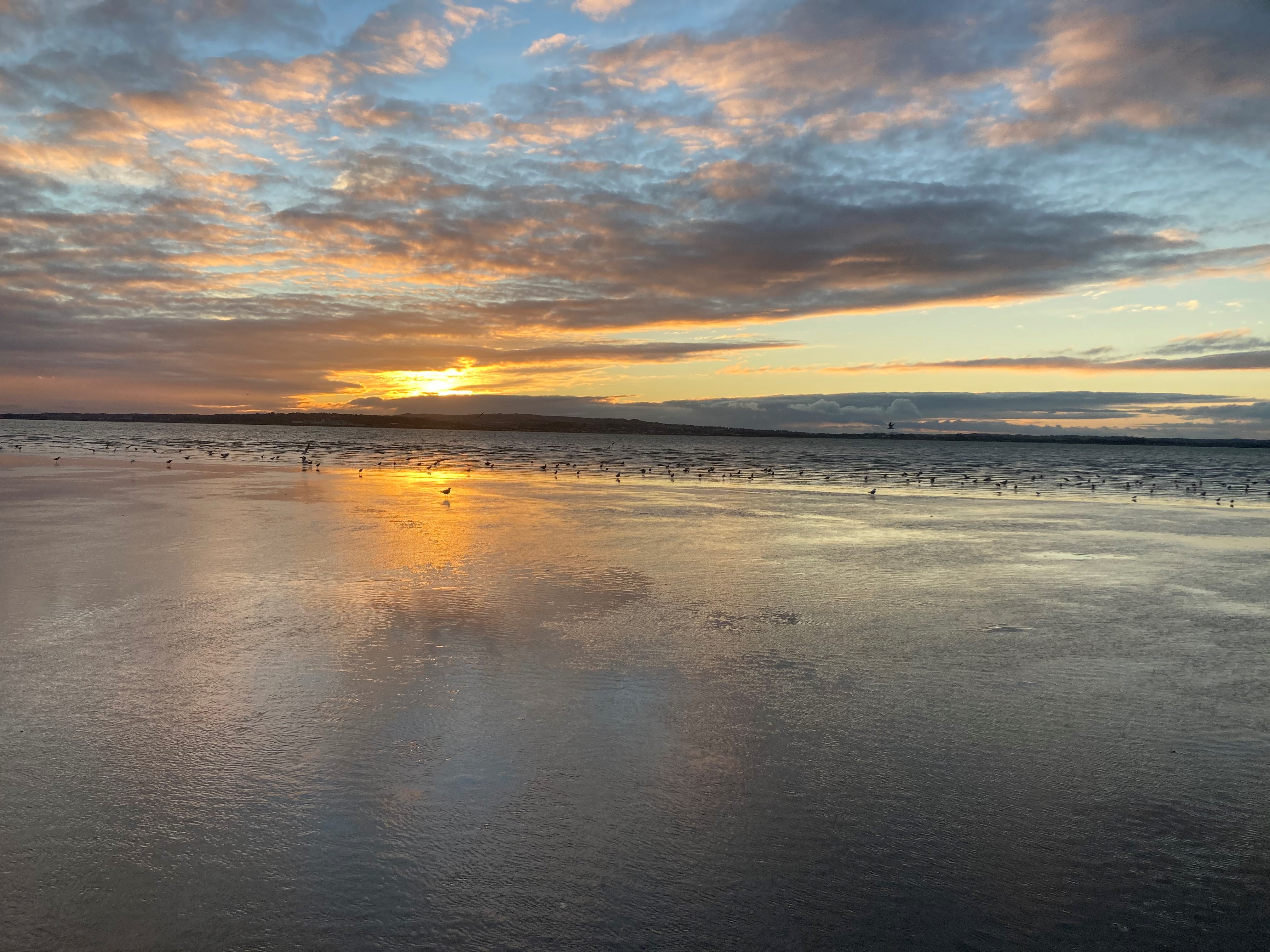 An autumnal sunset on a beach in Wexford