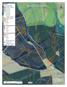 A detailed catchment map of the Three Mile Water_020 Waterbody showing phosphorus PIP ranks (1–7) and delivery paths categorized as high, medium, or low. The map includes river routes, streams, and polygons for water bodies. Red dots highlight focused delivery points with varying risk levels. Background shows aerial imagery of fields and forested areas, with roads and landscape features visible. Includes a scale bar (0–0.2 km) and north arrow.